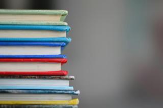 books stacked by kimberly-farmer-luaakcuanvi-unsplash